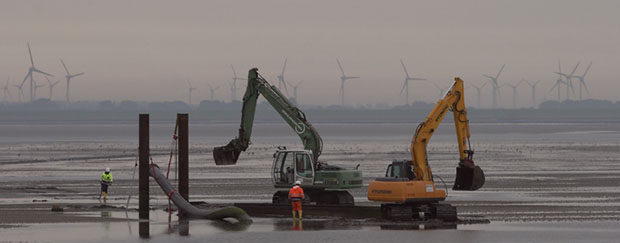 Bagger im Wattenmeer